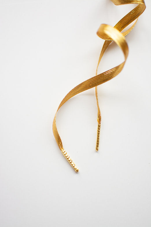 Golden Hour Luxe – platte veters in glanzend goud