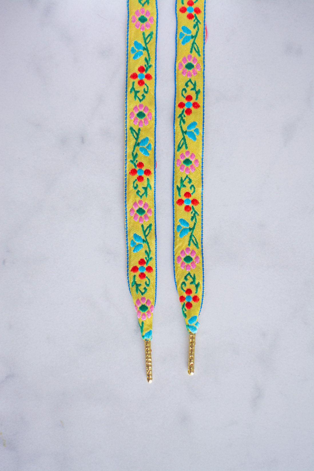 Veters plat jacquard - geel met bloemen - langs 1 kant bedrukt (Limited edition)
