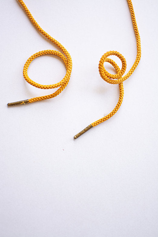 Schoenveters rond koord mosterd geel