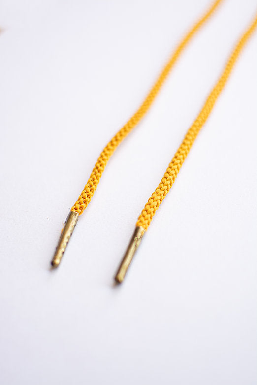 Schoenveters rond koord mosterd geel